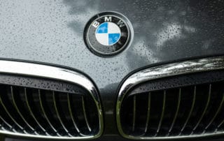 Bmw motor company badge on the front from a black car