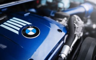 Engine motor of BMW car close-up with emblem
