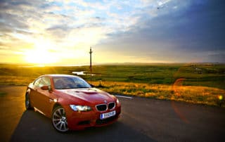BMW M3 car drives through a beautiful scenery