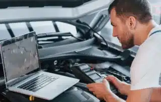 Technician performing specialized service on a European vehicle at Foreign Affairs Auto, ensuring top performance and reliability.