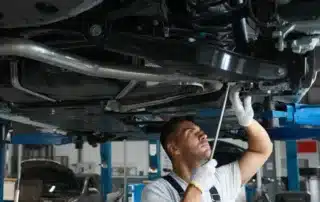 Certified European auto mechanic servicing a BMW