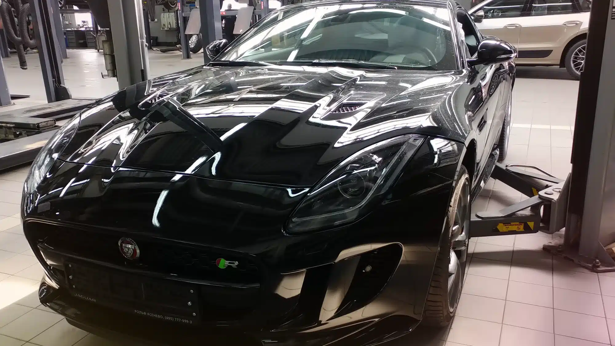 Professional Jaguar auto repair service at Foreign Affairs Auto with certified technicians performing luxury vehicle maintenance